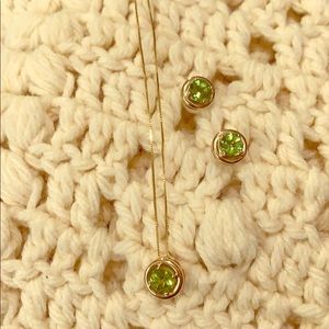 14 k peridot round pendant and stud earring set.